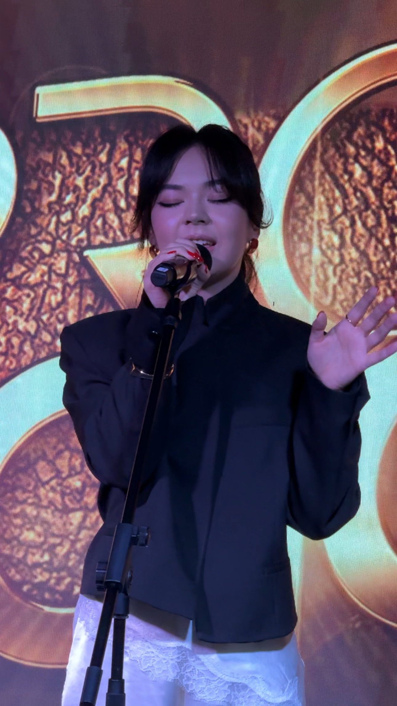 Singing on stage, close up